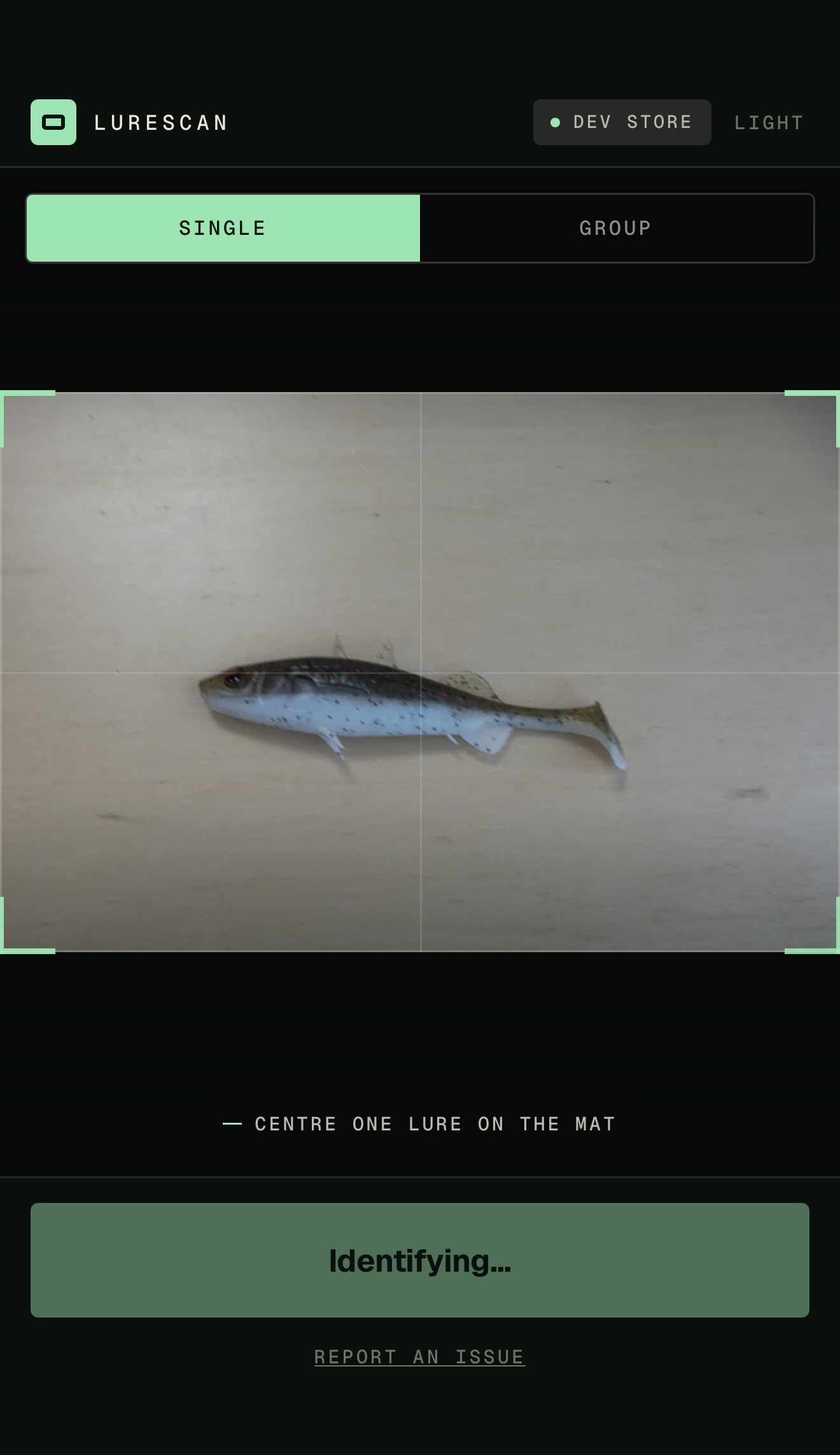 The LureScan app on a phone, identifying a lure on the counter mat